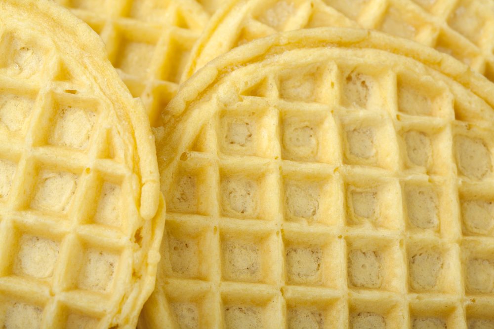 Frozen buttermilk waffles background; close up view