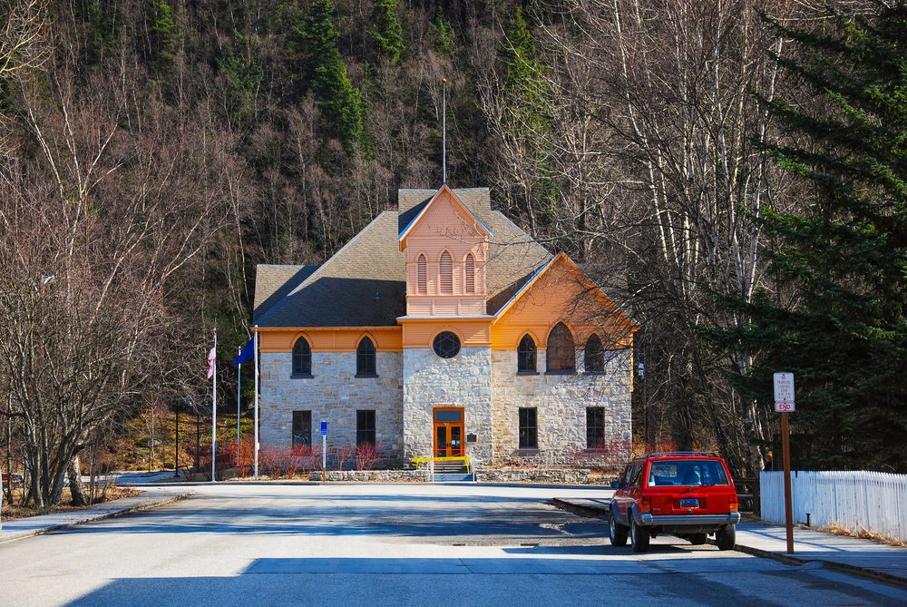 House and vehicle around with tree in Skagway Alaska, Tower,Hoose style 