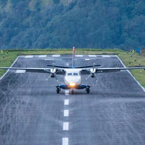 Plane landing on the runway of Lukla airport one of the most dangerous airport in the world.