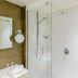 Here's Why So Many Hotel Showers Have Just Half a Door